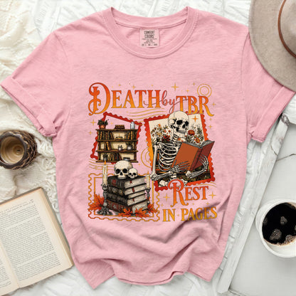 Pink t-shirt with skeleton reading and quote: "Death by TBR, Rest in Pages"