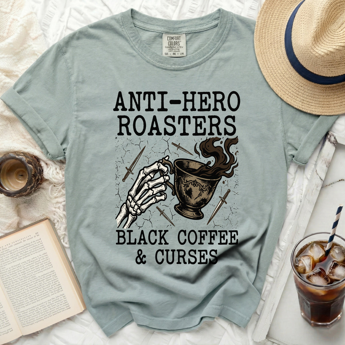 Shirt with "Anti-Hero Roasters Black Coffee & Curses" text and graphic.
