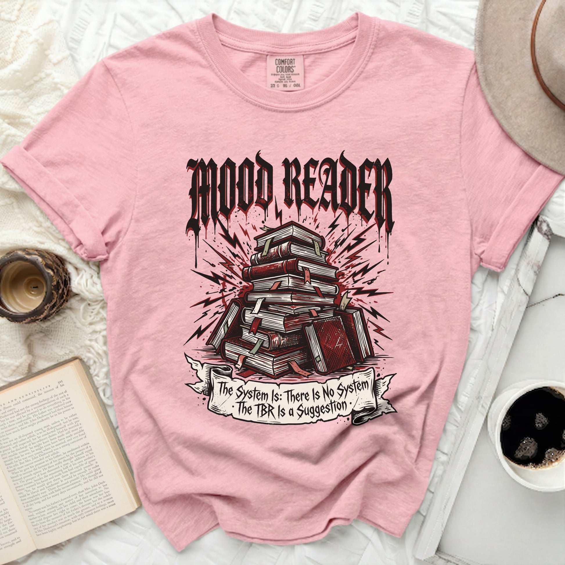 Pink t-shirt with "Mood Reader" and stacked books design.