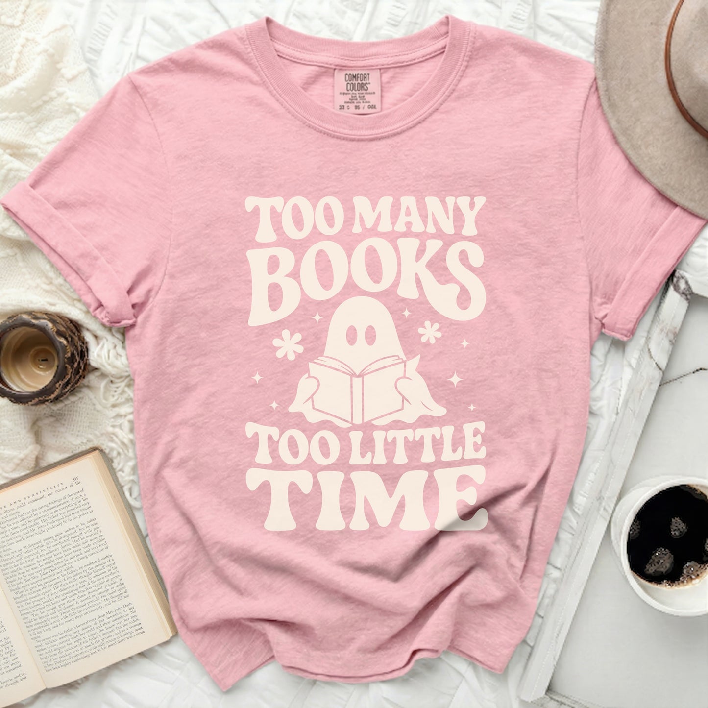 Pink t-shirt with "Too Many Books Too Little Time" and a ghost reading a book.