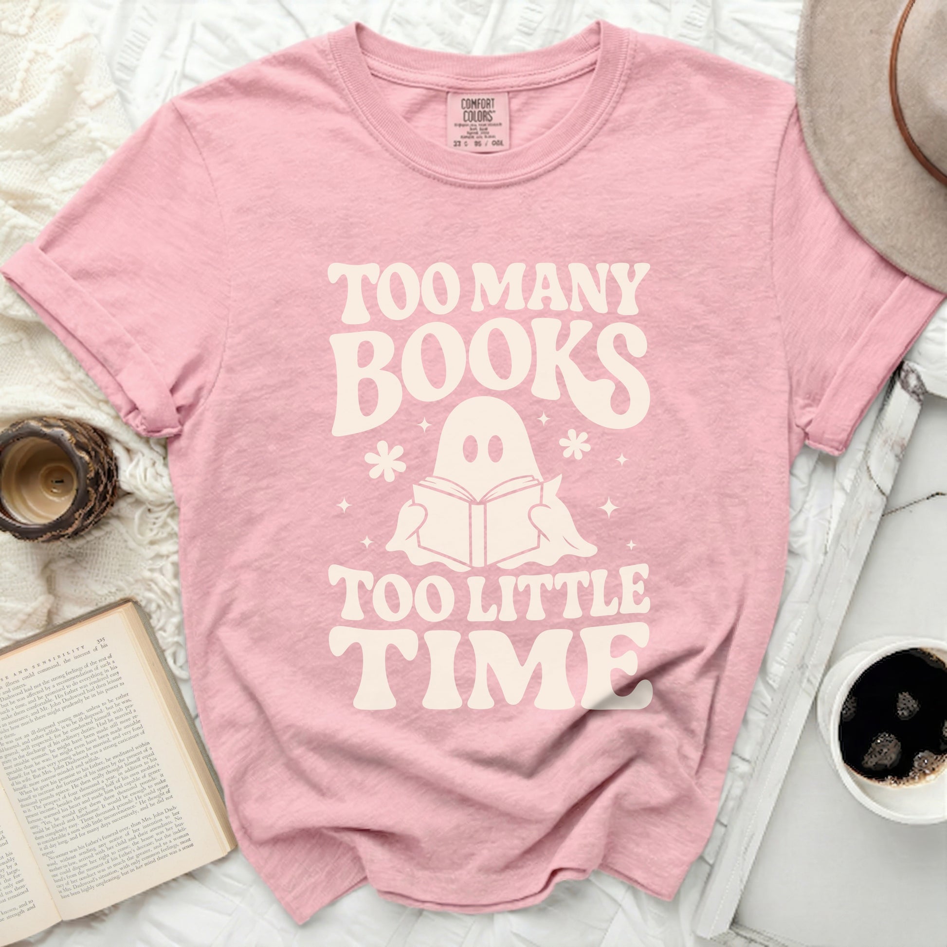 Pink t-shirt with "Too Many Books Too Little Time" and a ghost reading a book.