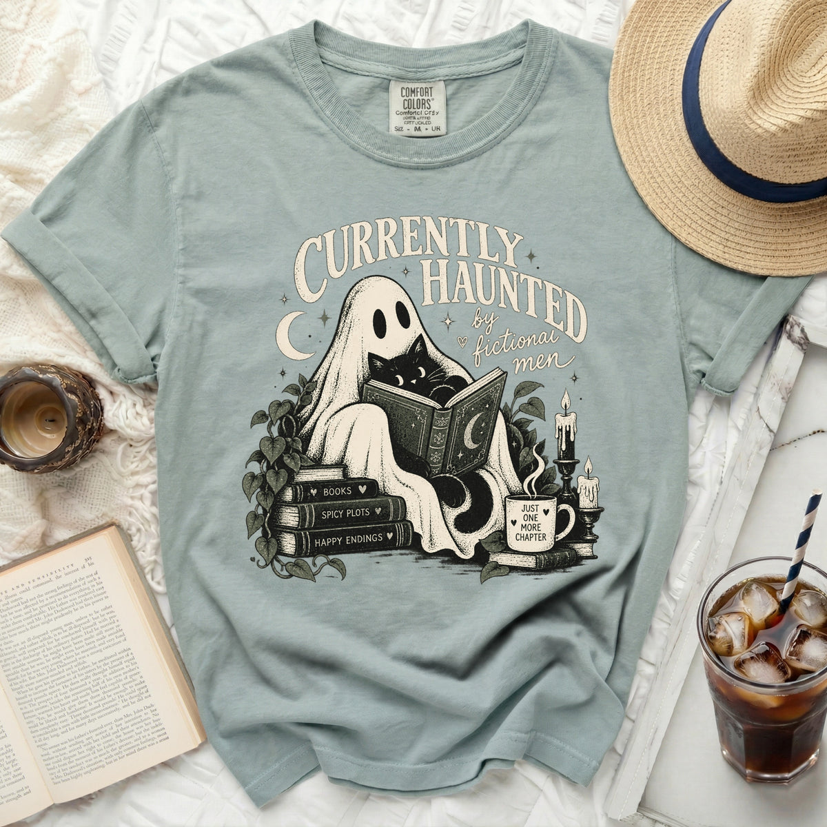 Ghost reading a book with a cat, "Currently Haunted by Fictional Men" text.