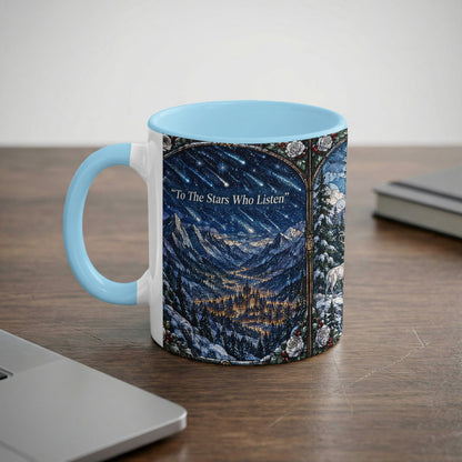 A light blue ceramic mug features a stained-glass style illustration of a night landscape and text that reads To The Stars Who Listen.