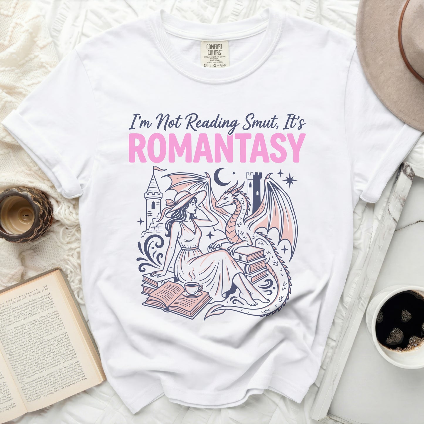 White t-shirt with "I'm Not Reading Smut, It's ROMANTASY" text and illustration.