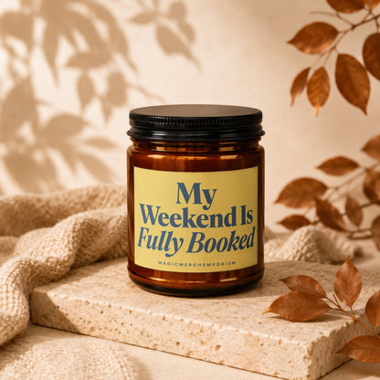Amber jar candle with yellow label reading "My Weekend Is Fully Booked".