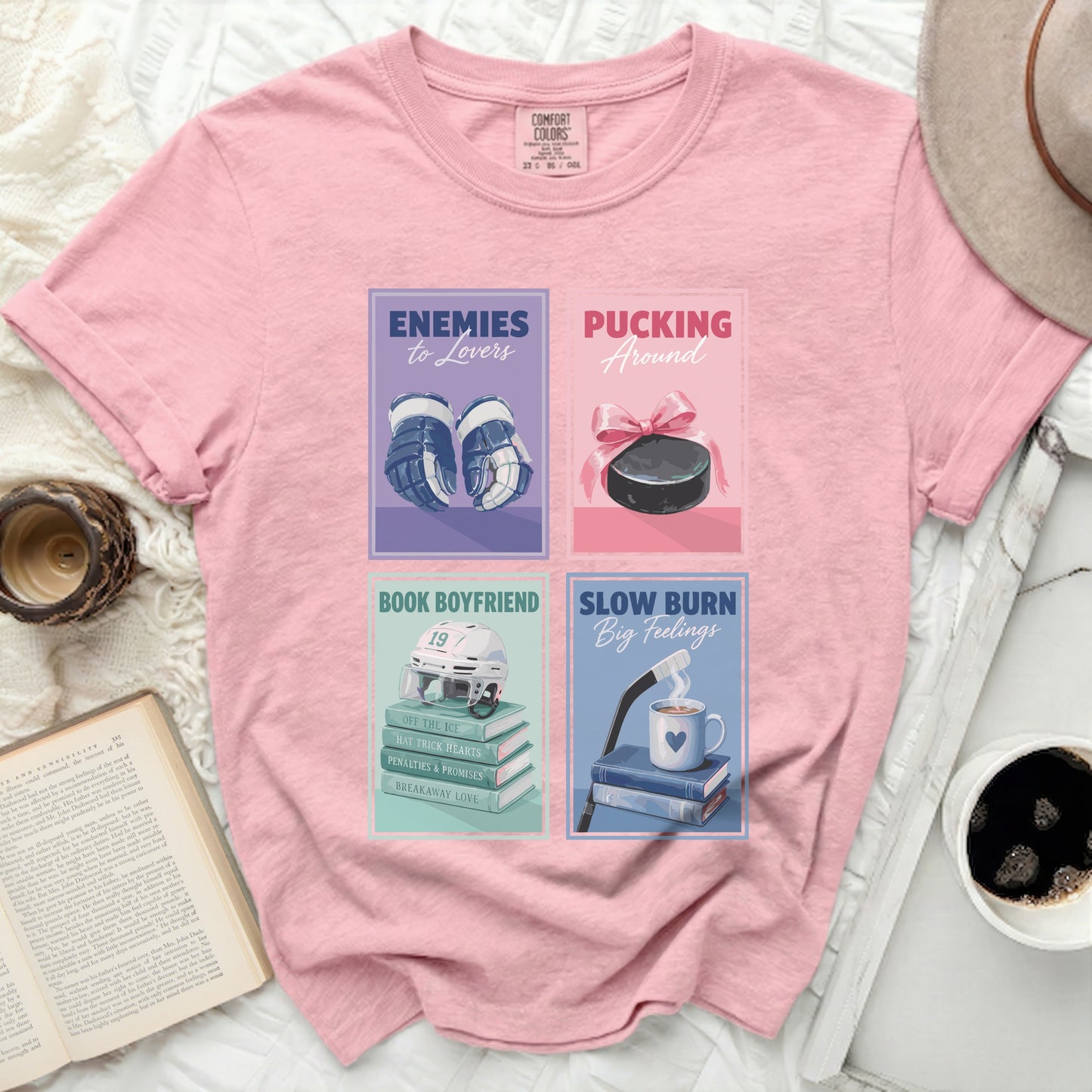 Pink t-shirt with four romance novel covers: hockey, puck, book, and coffee cup.
