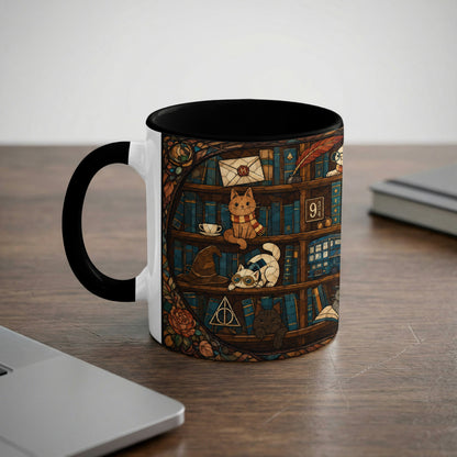 Mug with a stained glass design of cats on a bookshelf with magical items.