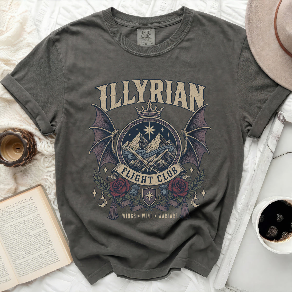 "Illyrian Flight Club" graphic t-shirt with wings, swords, mountains, and roses.