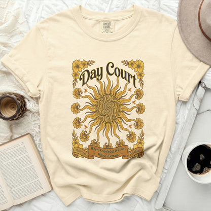 Cream t-shirt with "Day Court Where Knowledge Is Power Helion's Domain Prythian" and sun graphic.