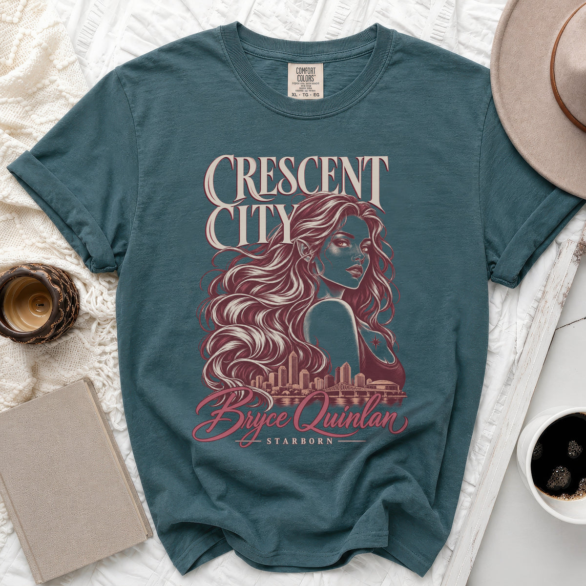Teal t-shirt with Crescent City graphic featuring Bryce Quinlan and cityscape.