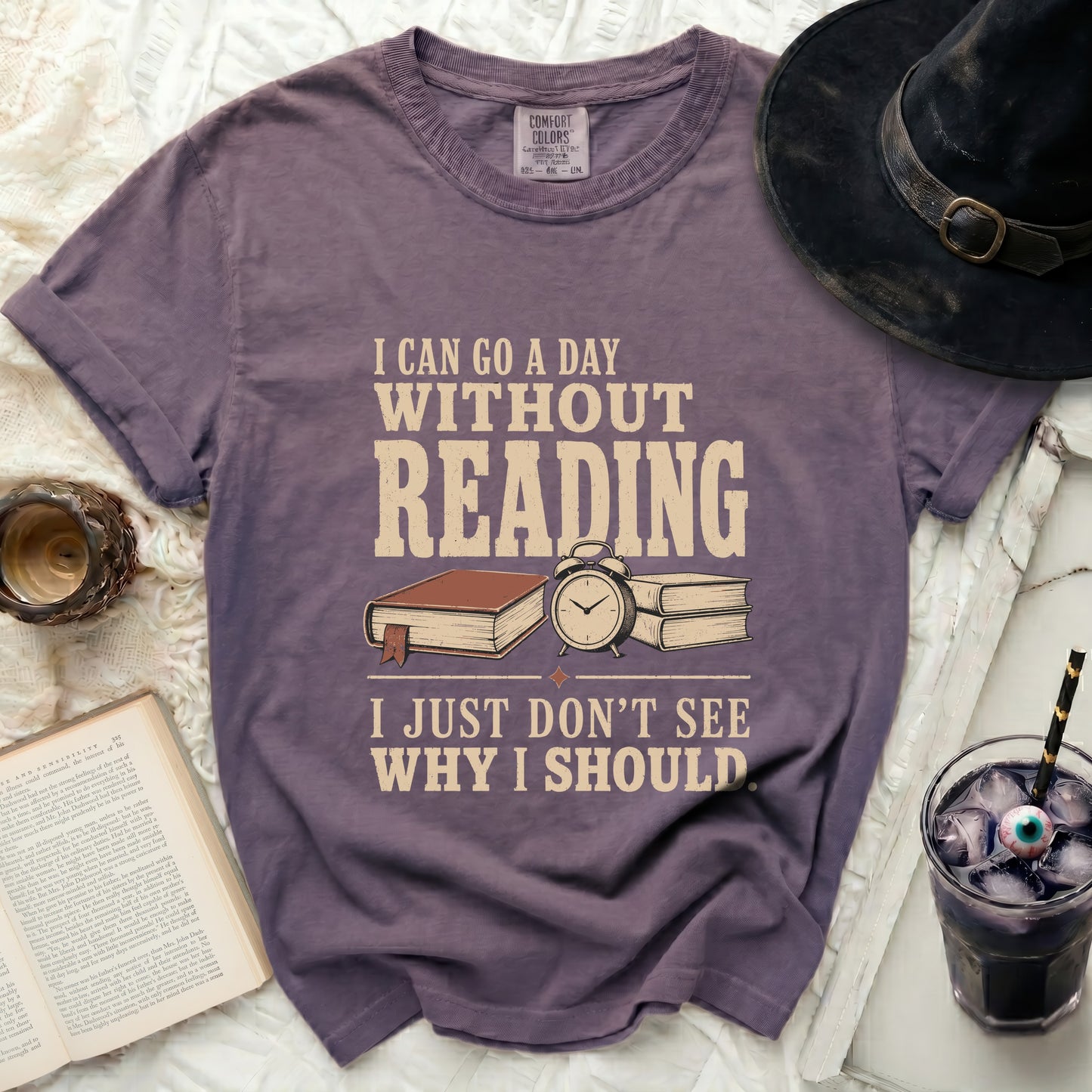 Purple t-shirt with "I can go a day without reading, I just don't see why I should" text.