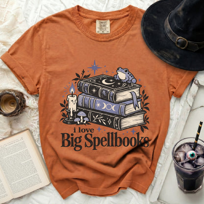 Orange t-shirt with spellbook graphic and text "i love Big Spellbooks".