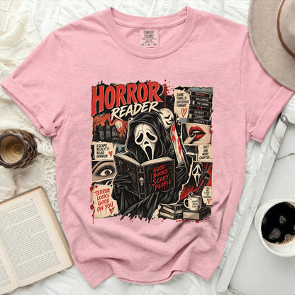 Pink Comfort Colors shirt with "Horror Reader" graphic featuring a ghost reading a book.