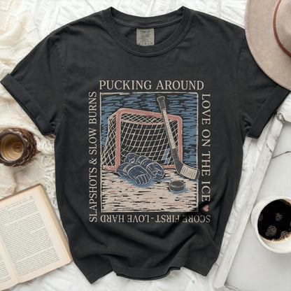 Black Comfort Colors t-shirt with hockey graphic and text.