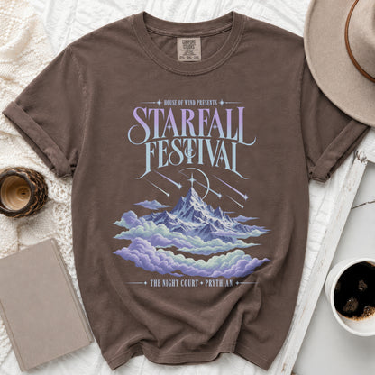 Brown t-shirt with "Starfall Festival" graphic, mountains, clouds, and text.
