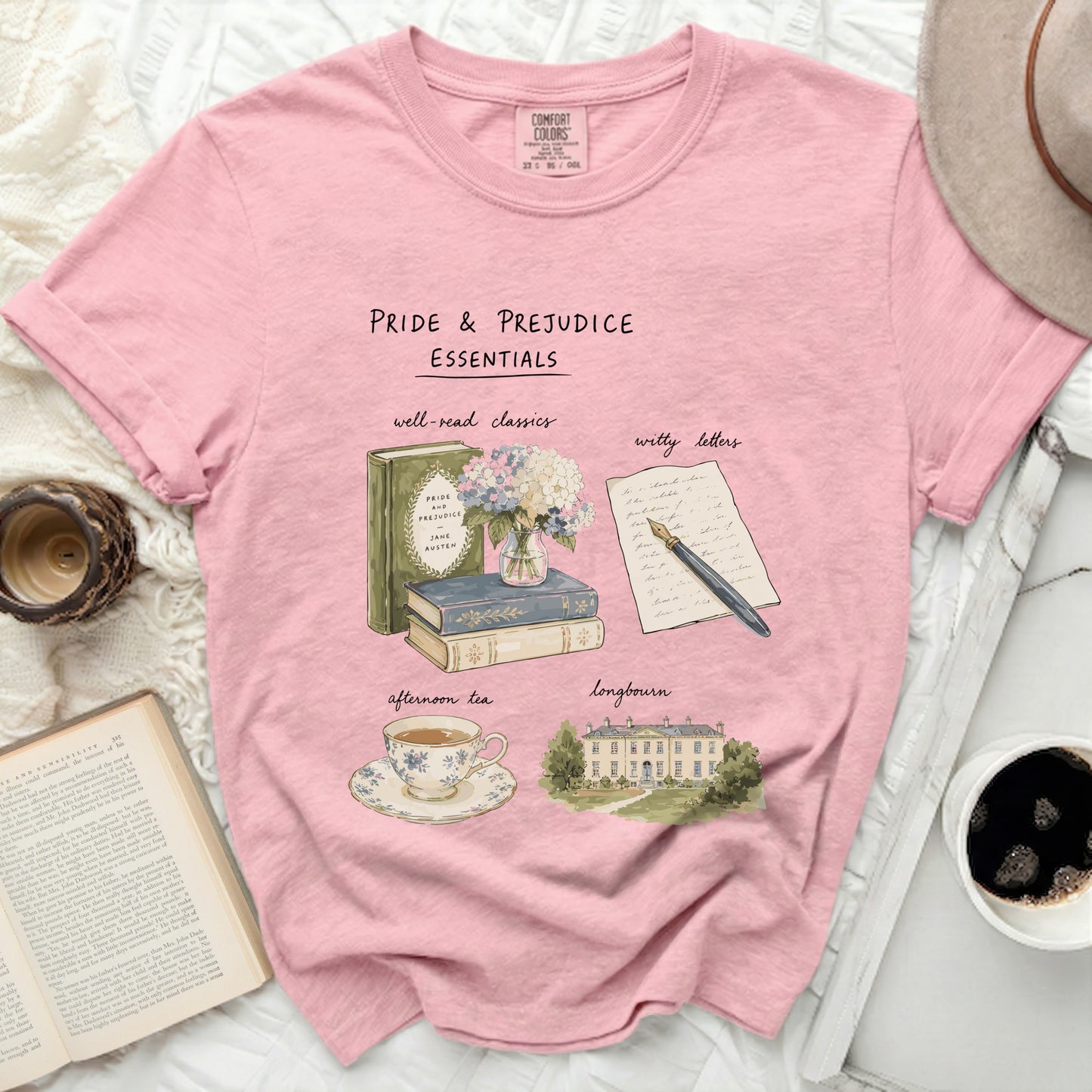 Pride & Prejudice Essentials graphic on a pink t-shirt with books, tea, and manor.
