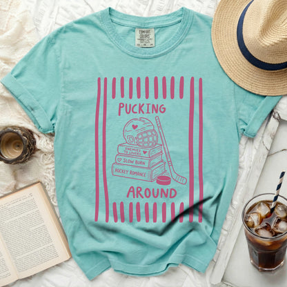 Aqua t-shirt with pink hockey romance graphic and text.