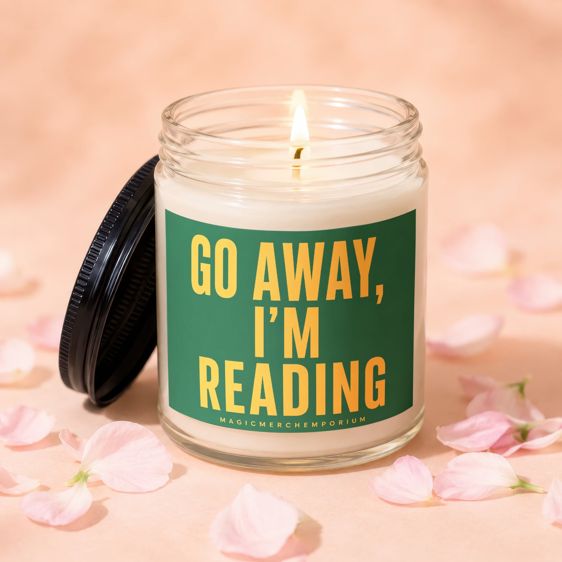 Glass candle lit with flame and "GO AWAY, I'M READING" text.