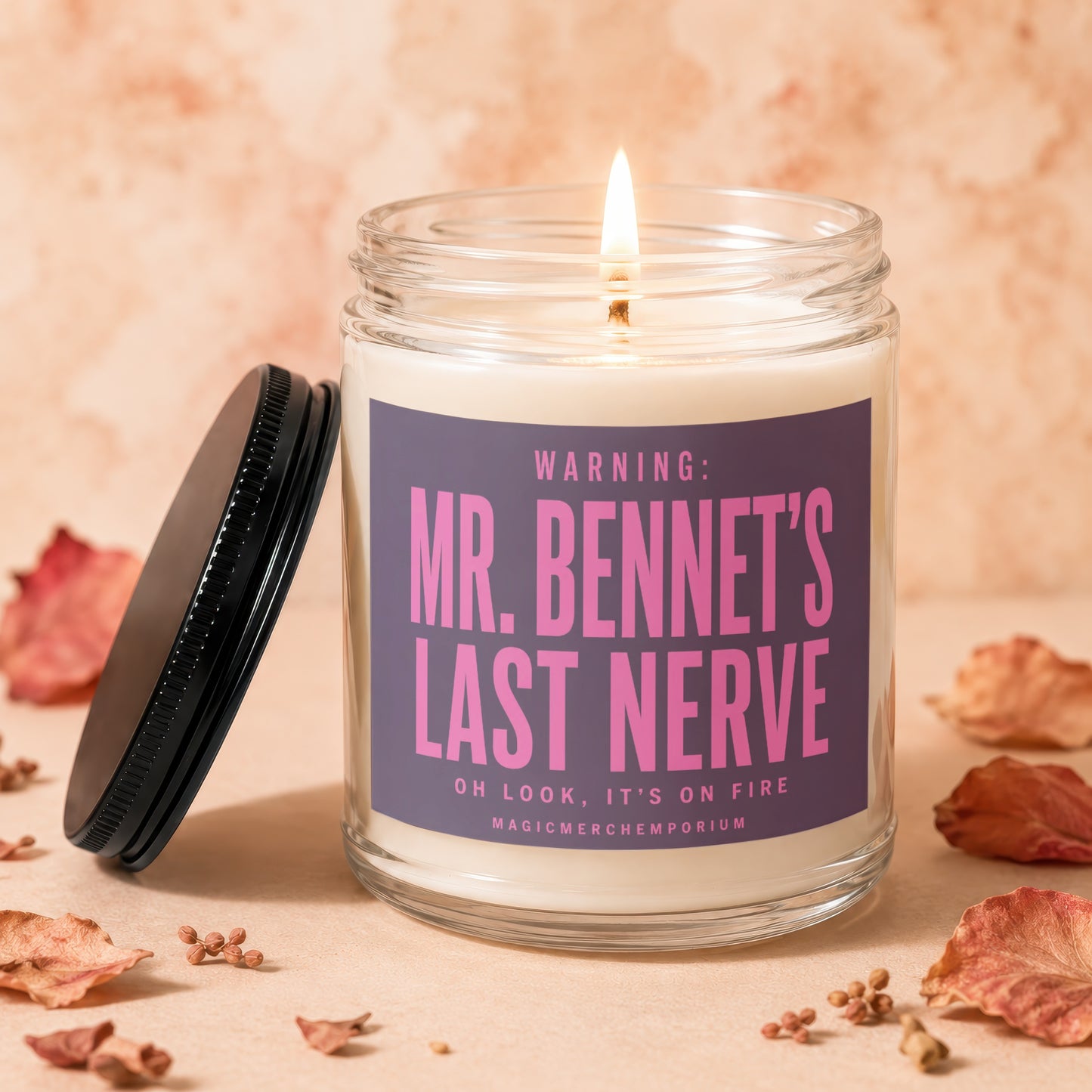 Lit candle in jar with "Mr. Bennet's Last Nerve" warning label and black lid.