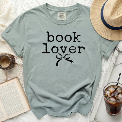 Comfort Colors t-shirt with "book lover" and bow graphic.