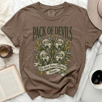 Brown t-shirt with "Pack of Devils" and wolves graphic.