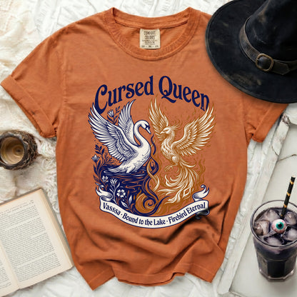 Orange t-shirt with "Cursed Queen" text, swan and phoenix design, and banner text.