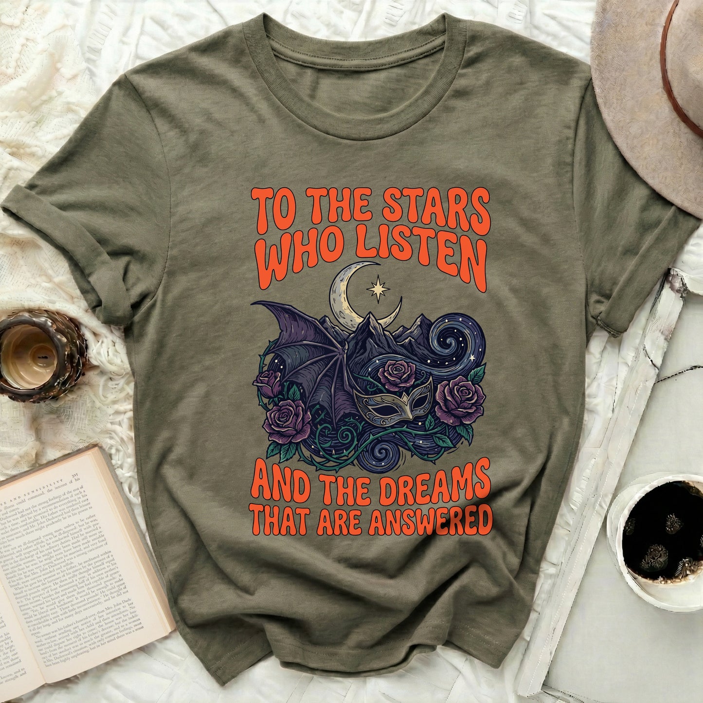 TO THE STARS WHO LISTEN AND THE DREAMS THAT ARE ANSWERED
Celestial design
Mystical apparel
Fantasy graphic
Moon imagery
Stars art
Bat wing design
Rose illustration
Masquerade mask
Mountain landscape
Dream themed
Quote shirt
Inspirational text
Aesthetic tee
Unique artwork
Dark fantasy
Spiritual motif
Galactic theme
Creative design
Nature elements
Mythical creatures