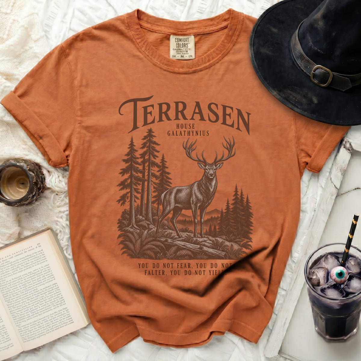 Terrasen House Galathynius t-shirt with a stag in a forest and quote.