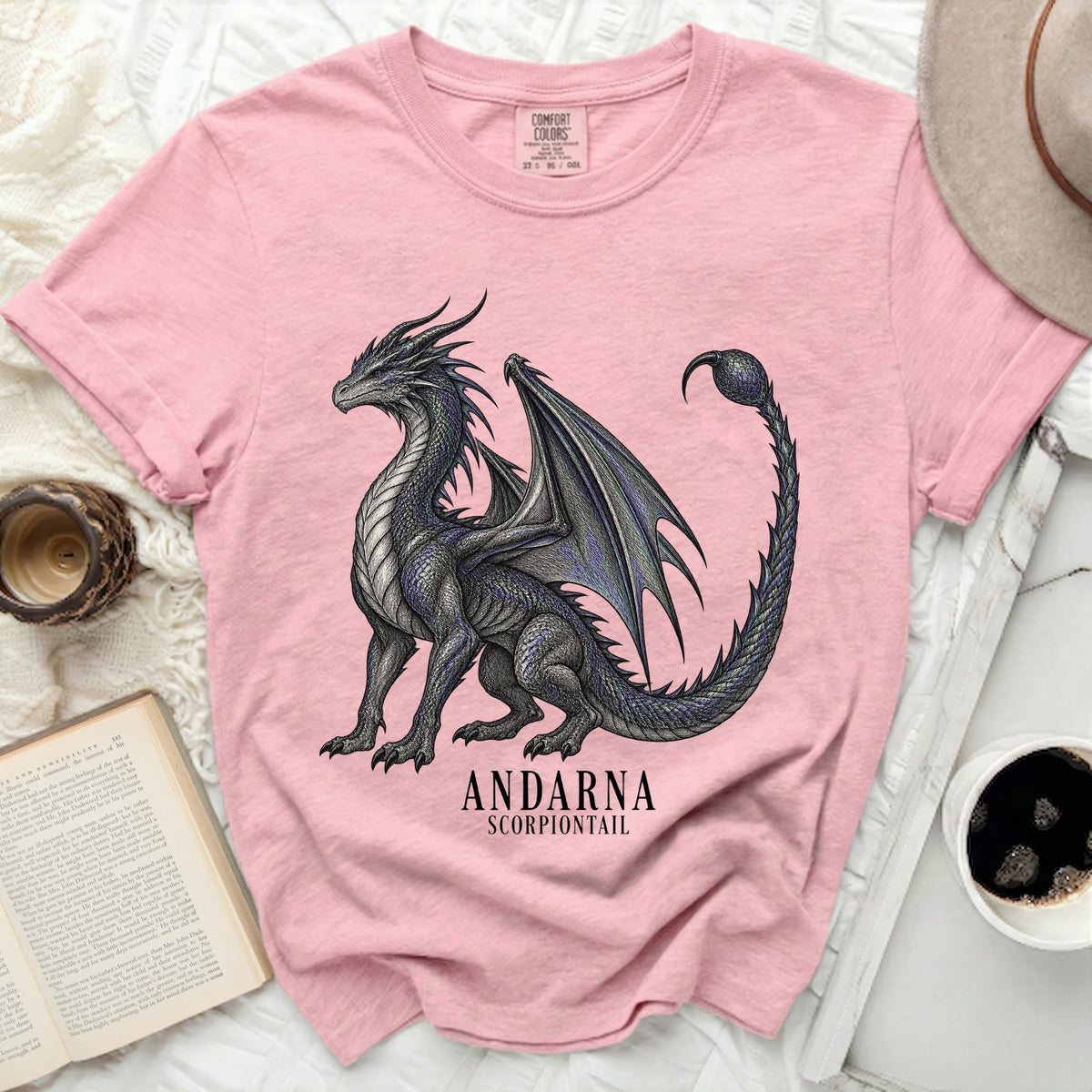 Pink t-shirt with a detailed black dragon graphic and text "ANDARNA SCORPIONTAIL".