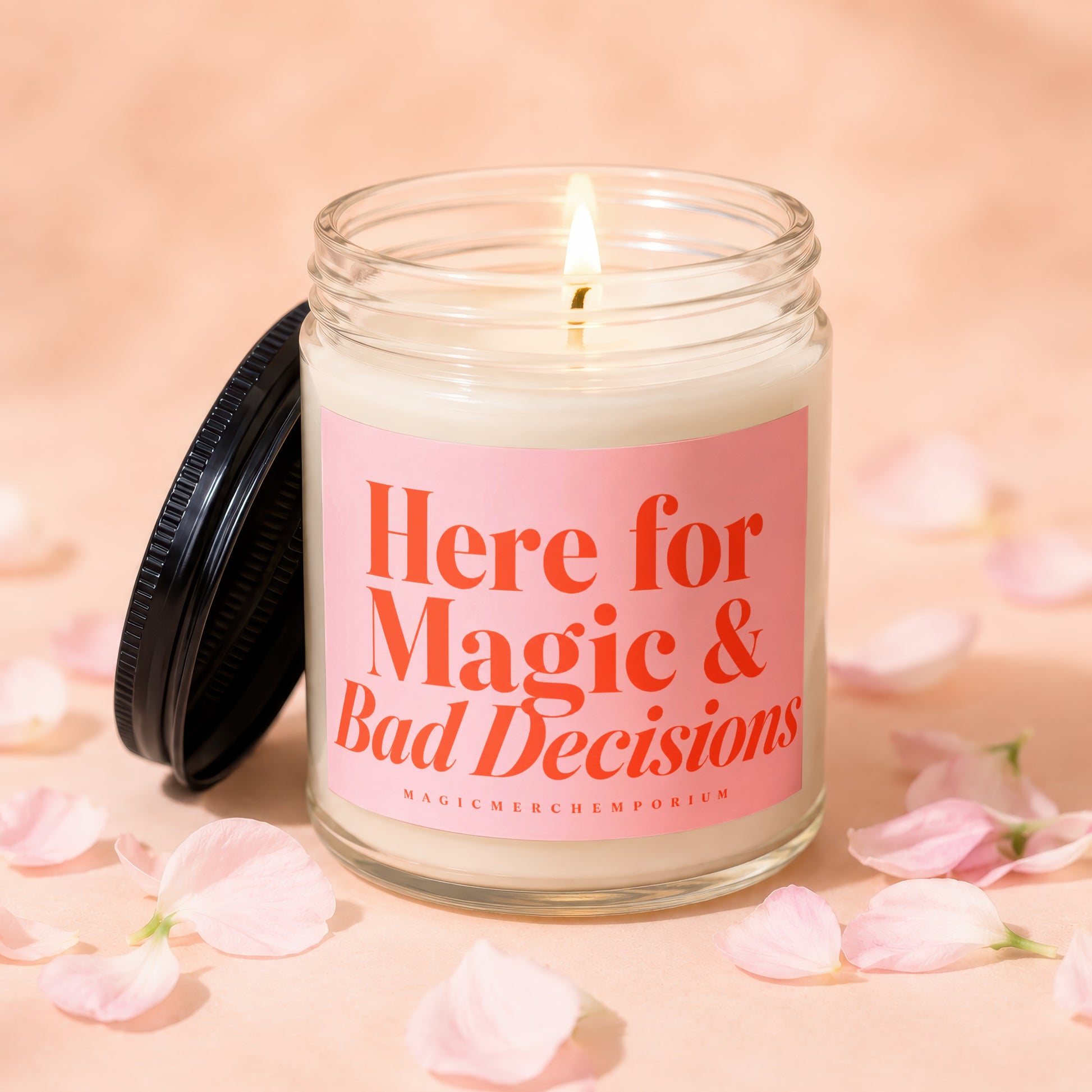 Jar candle with pink label reading "Here for Magic & Bad Decisions".