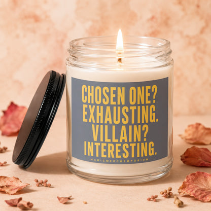 Lit candle in glass jar with text "Chosen One? Exhausting. Villain? Interesting."