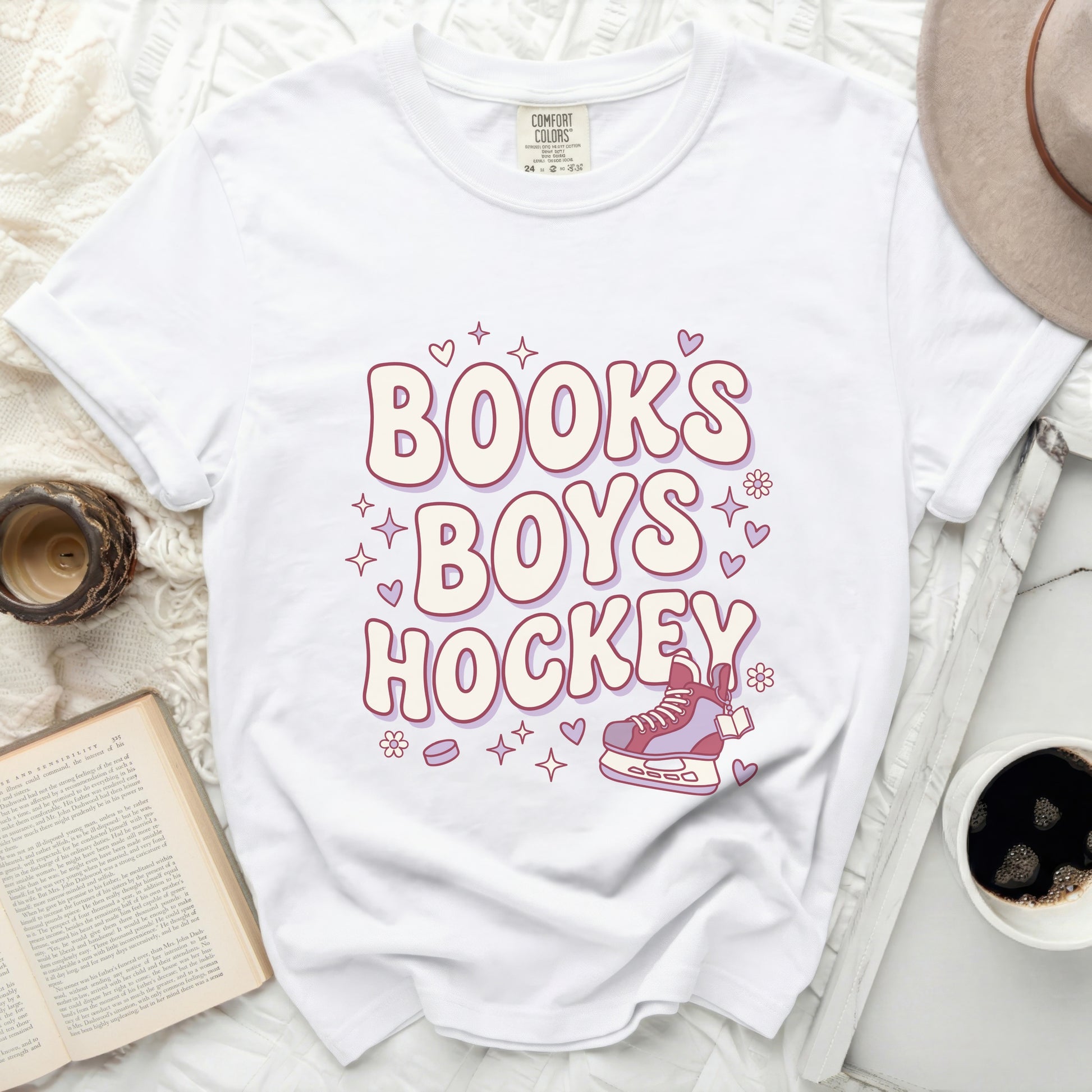 White t-shirt with "BOOK'S BOYS HOCKEY" text and ice skate graphic.