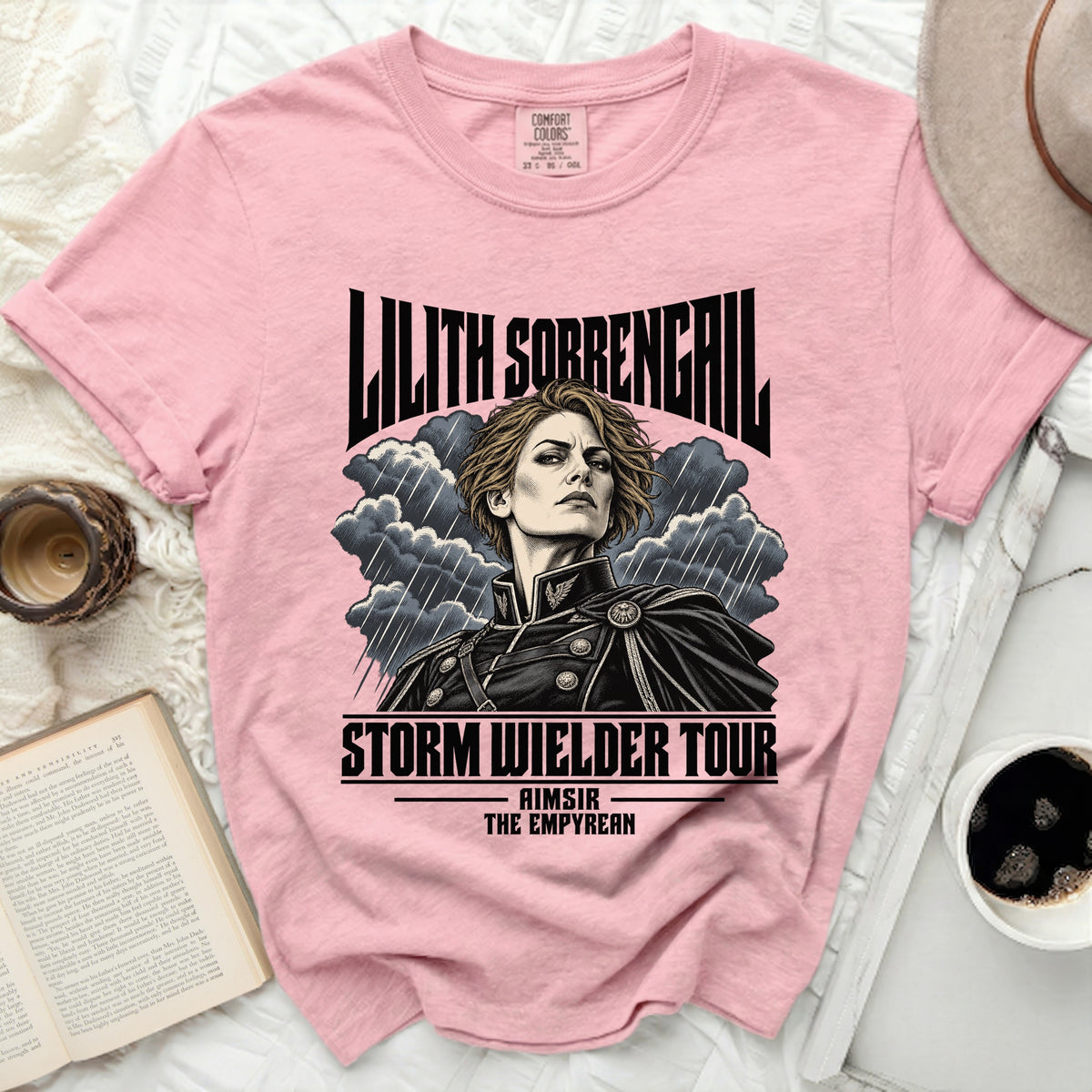 Pink t-shirt with "Lilith Sorrengail Storm Wielder Tour" and character art.