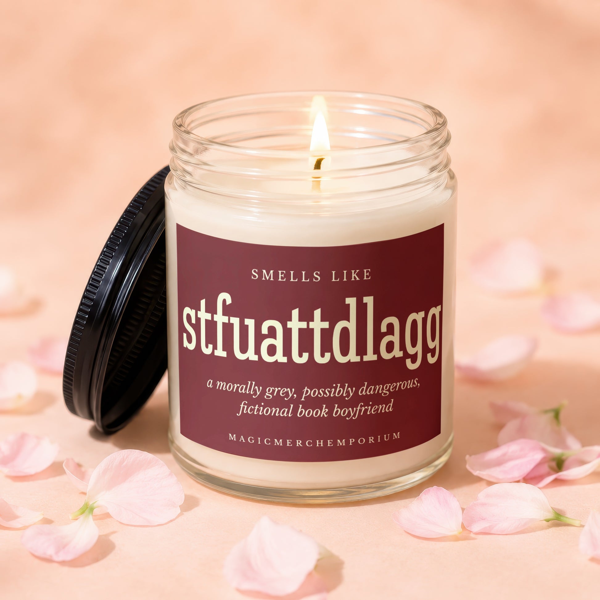 Candle with "stfuatttdlag" label and "fictional book boyfriend" description.
