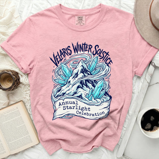 Pink t-shirt with Velaris Winter Solstice Annual Starlight Celebration graphic.