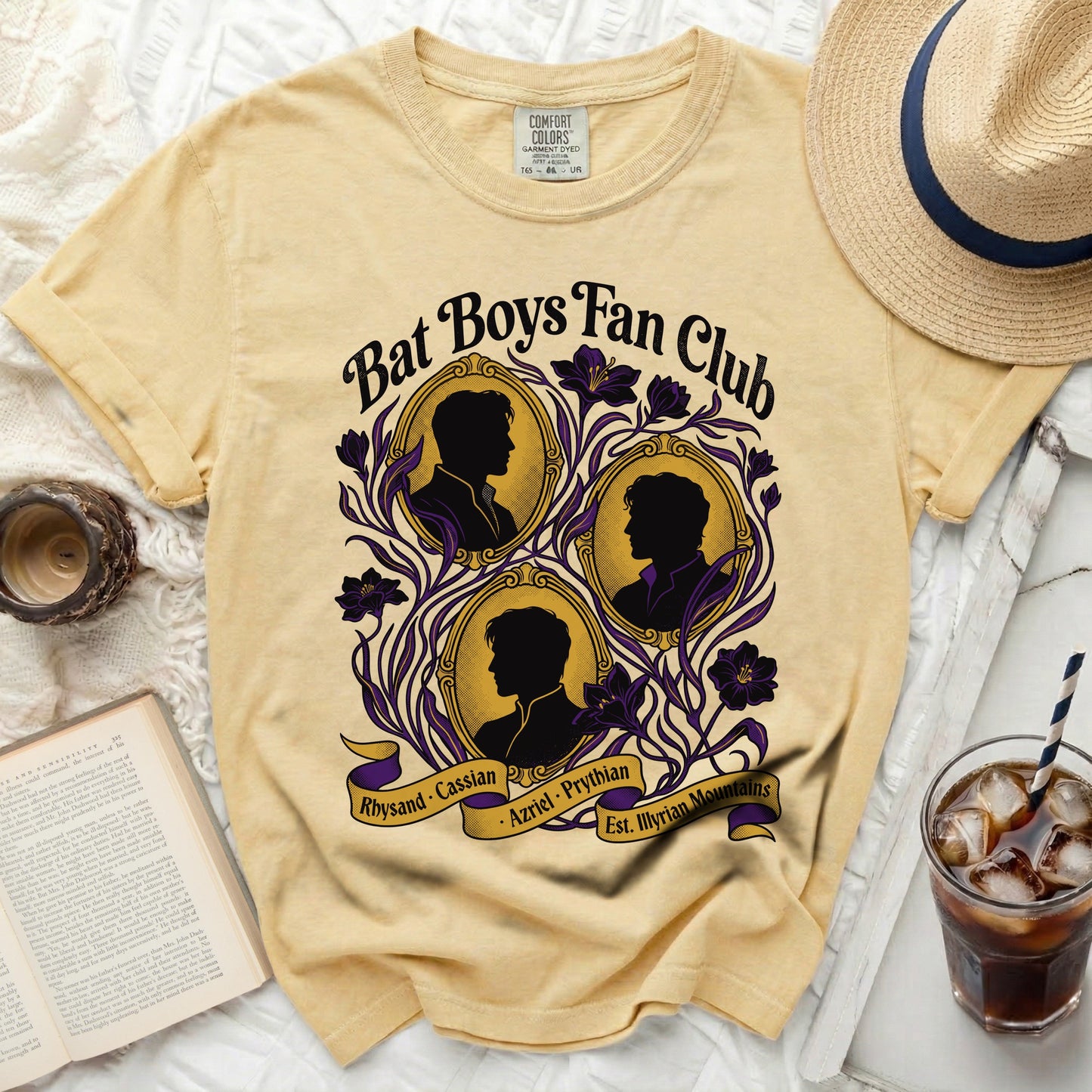 Yellow Bat Boys Fan Club t-shirt with black silhouettes and purple floral accents.