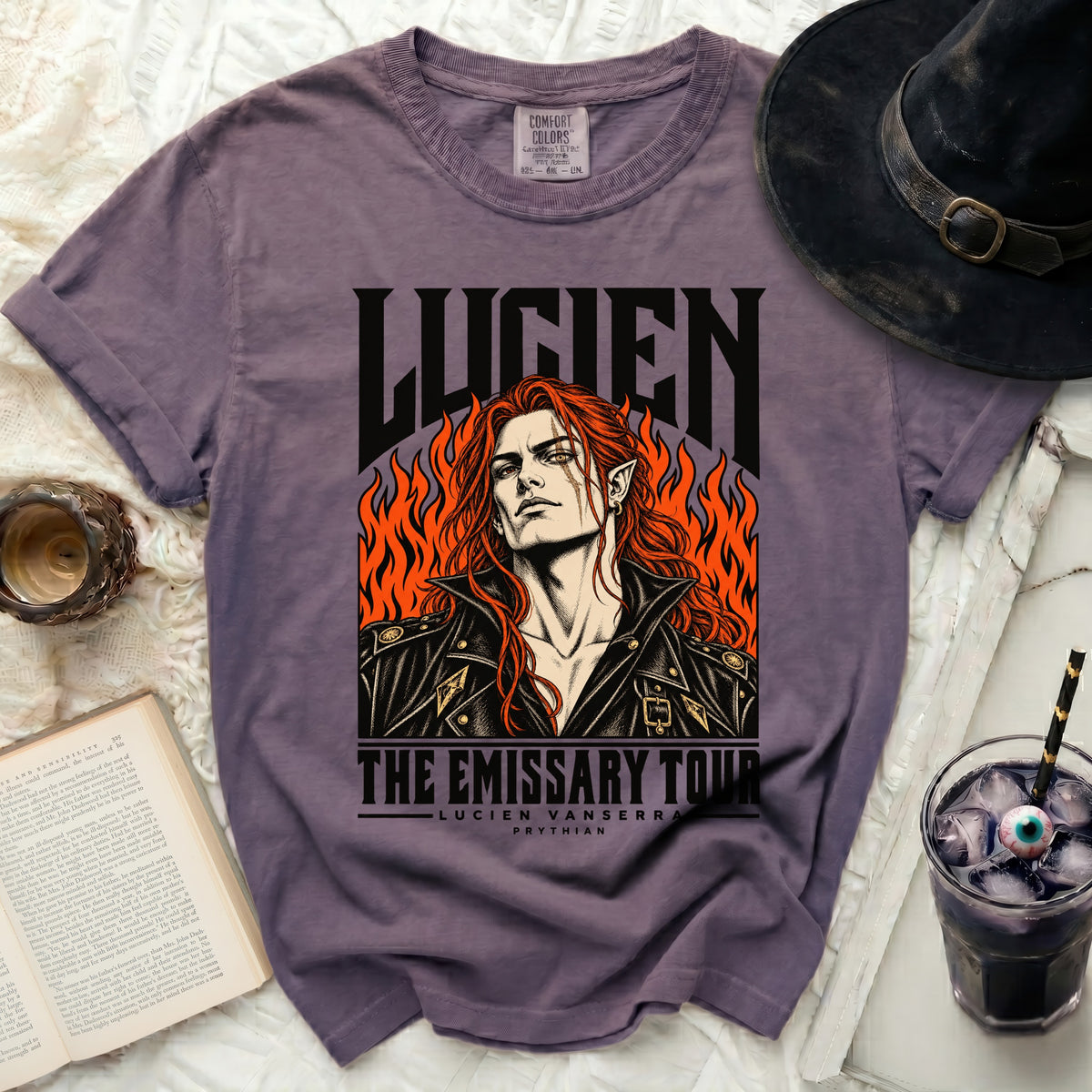 Purple t-shirt with Lucien The Emissary Tour graphic and text.