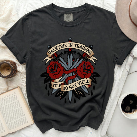 Dark t-shirt with "VALKYRIE IN TRAINING YOU DO NOT YIELD" text and swords.