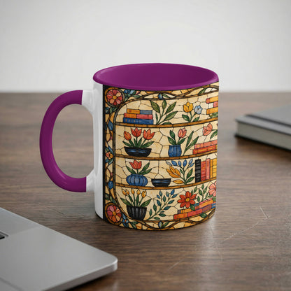 Mug with purple handle and interior featuring a stained glass design of bookshelves with flowers.