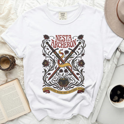 White t-shirt with "Nesta Archeron Cauldron Blessed Valkyrie Death Lady of Embers Prythian" graphic.