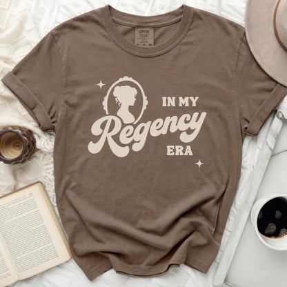 Brown t-shirt with "In My Regency Era" graphic and cameo portrait.