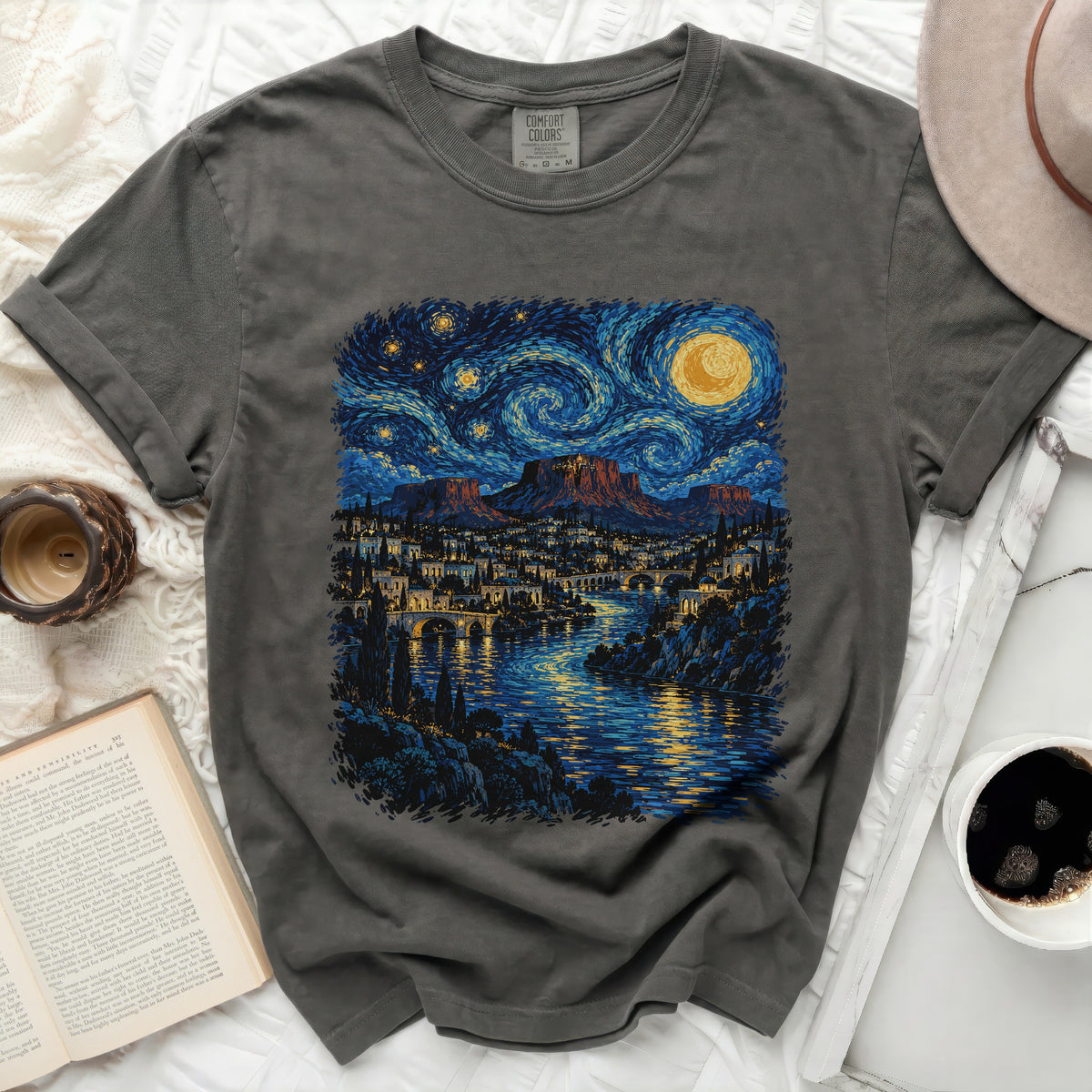 Dark gray t-shirt with a Van Gogh-inspired starry night landscape print.