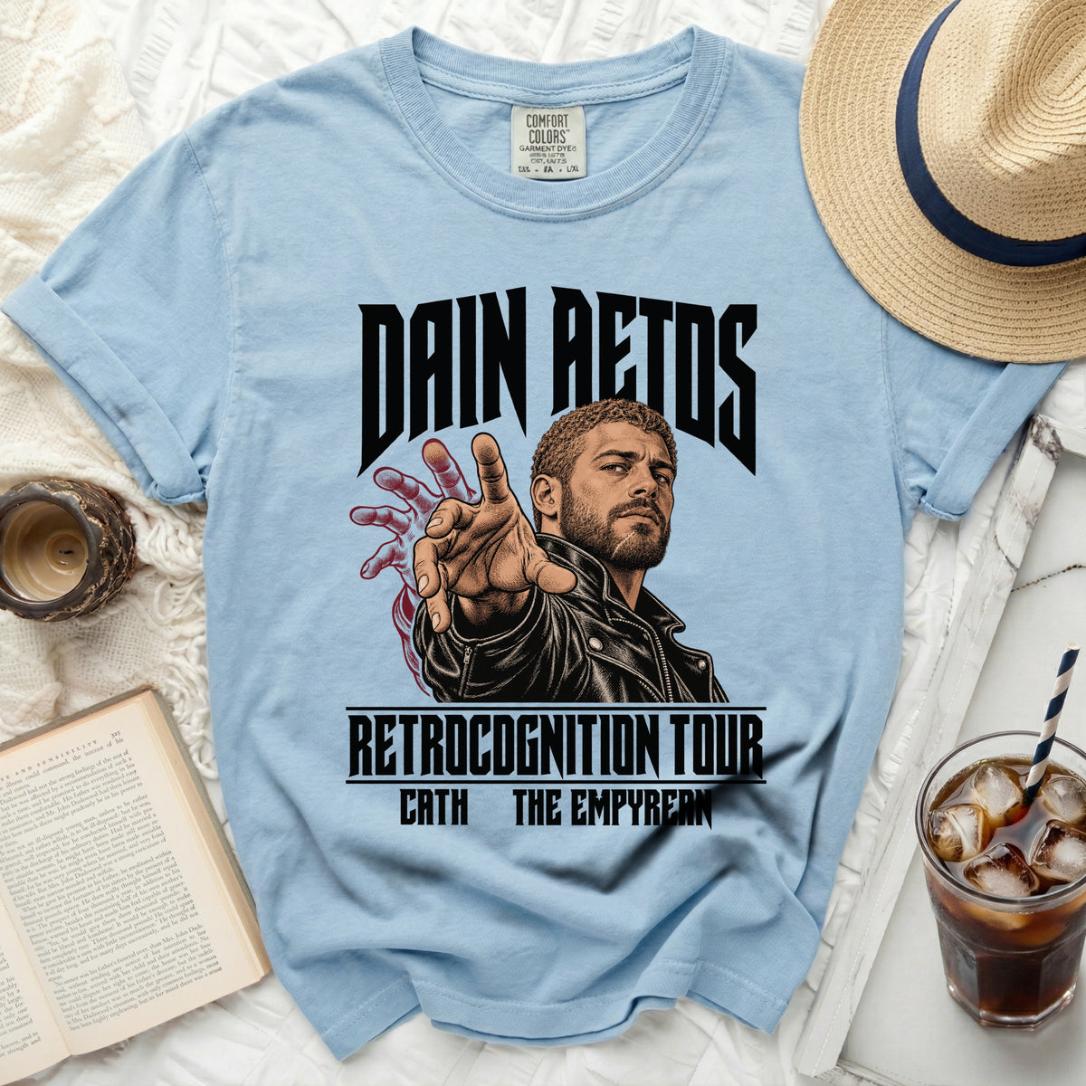 Light blue t-shirt with "DAIN AETOS RETROCOGNITION TOUR CATH THE EMPYREAN" graphic.