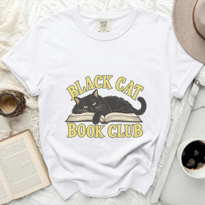 White t-shirt with black cat on open book graphic, reading "Black Cat Book Club".