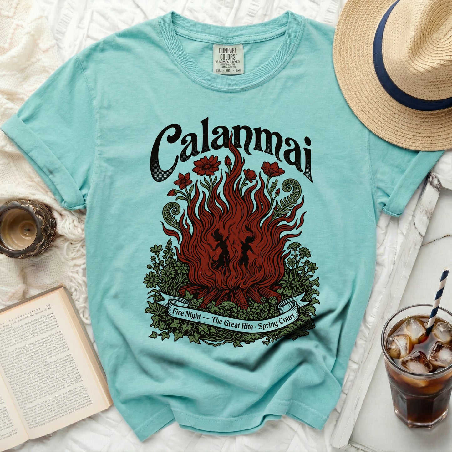 Aqua t-shirt with a graphic of flames, flowers, and the text "Calanmai Fire Night - The Great Rite - Spring Court".