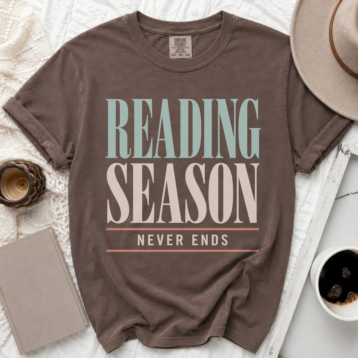 Brown t-shirt with "READING SEASON NEVER ENDS" text in vintage lettering.