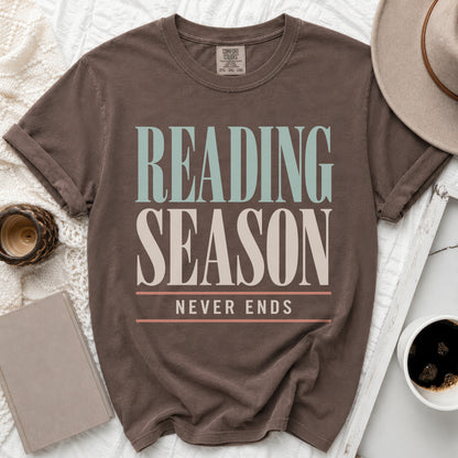 Brown t-shirt with "READING SEASON NEVER ENDS" text in vintage lettering.
