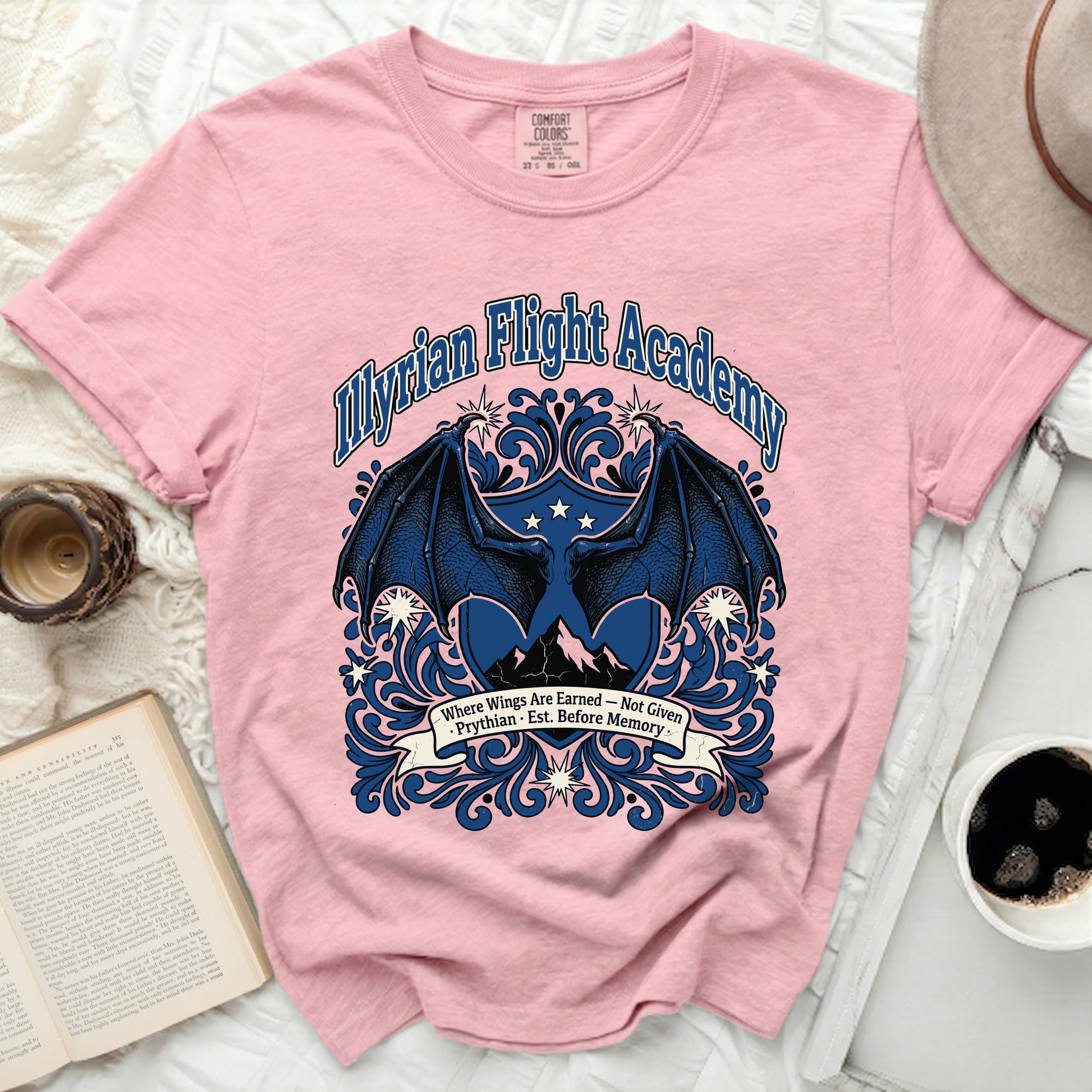 Pink t-shirt with "Myrian Flight Academy" and wings graphic.