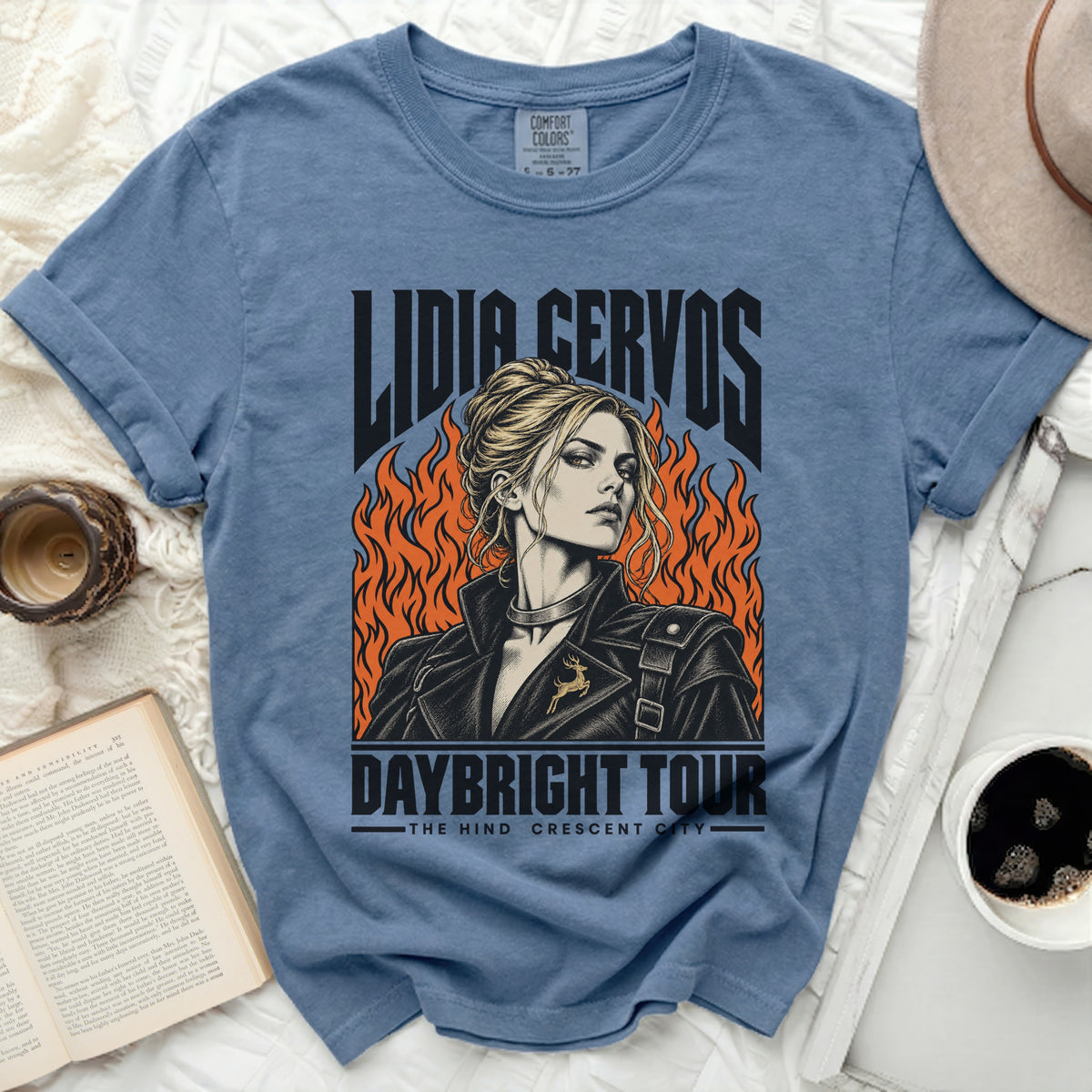 Lidia Cervos Daybright Tour graphic tee with flames and a deer emblem.