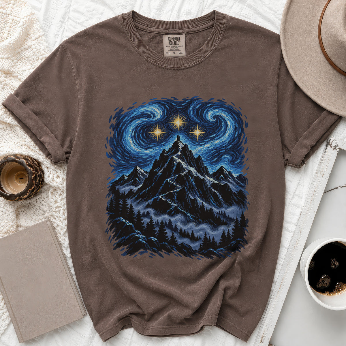 Brown t-shirt with starry night mountain graphic and Comfort Colors label.